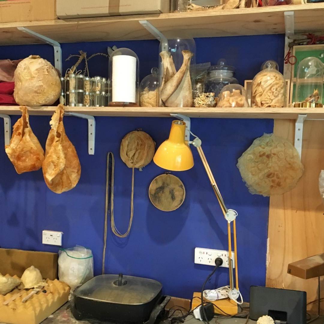 Photo of an artists studio with blue walls.